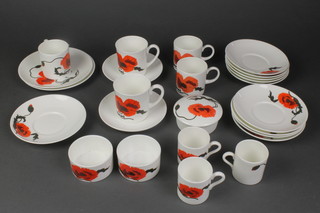 A Wedgwood Susie Cooper design Cornpoppy tea and coffee service comprising 4 coffee cans, 6 tea cups, 8 mugs, 1 lidded box, 2 dishes, 10 saucers and 5 odd saucers
