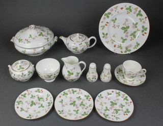 A Wedgwood Wild Strawberry tea and dinner service comprising 5 tea cups, 6 saucers, 4 small tea plates, 8 tea plates, 6 side plates, 8 dinner plates, 8 soup bowls, a small tea pot, salt and pepper, milk jug, sugar bowl and lid, slop bowl, tureen and lid 