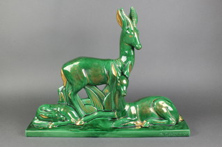 A green and gilt glazed Art Deco figure group of a family of deer, impressed mark CH.Lemanceau 18" 