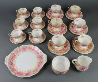 A Royal Albert Serena tea and coffee set comprising 6 coffee cups, 6 saucers, 6 tea cups, 6 saucers, a cream jug, sugar bowl, a sandwich plate and 6 small plates