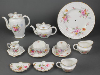 A Royal Crown Derby Derby Posies pattern tea and coffee set comprising 6 coffee cups, 5 saucers, 7 tea cups, 6 saucers, cream jug, 2 milk jugs, sugar bowl, small tea pot, coffee pot, 5 tea plates, 7 odd dishes and a cake stand