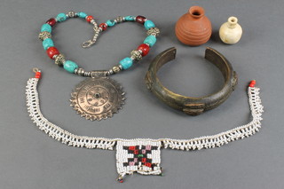 A bead work necklet 15", a Mexican necklet, a bronze shackle bracelet 