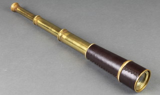 A brass and leather 3 draw telescope 