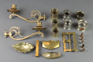 A pair of Art Nouveau brass candle sconces, 3 metal spirit measures, 2 pewter spirit measures and other curios 