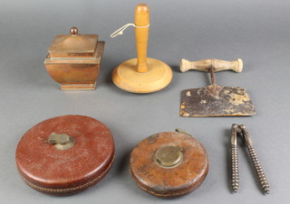 A 19th Century rectangular waisted copper caddy with hinged lid 4", a wooden darning mushroom, a pair of polished steel nut crackers, a Chesterman 100' tape measure, John Rabone 100' tape measure and a dough slicer 