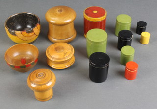 A Victorian cylindrical turned box containing a collection of counters 2", 2 Victorian turned wooden jars and covers 2" and 1 1/2", 14 Victorian cylindrical stacking boxes and 2 turned wooden bowls 
