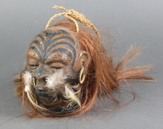 A wax model of a shrunken head 5" 