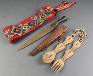 A South American embroidered sash/girth, a carved wooden fork and spoon and an Eastern dagger with 8 1/2" double edge blade