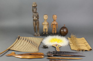 A trinket box formed from a coconut 5", 3 carved wooden figures, a fan etc 