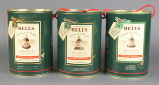 3 ceramic Wade decanters containing 225cl of Bells Whisky to commemorate Christmas 1989, 1990 and 1991, boxed  
