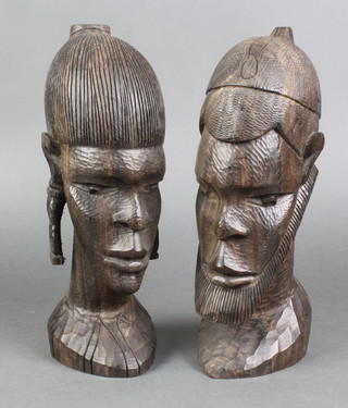 A pair of carved African portrait busts of a bearded gentleman and lady 11" 