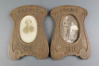 A pair of First World War carved wooden photograph frames marked France 1918 8" x 6",  