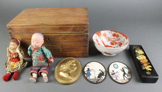 A doll with articulated limbs 8" together with a costume doll 6", a Victorian lacquered and floral patterned painted pencil box 7 1/2" and other curios contained in a pine box with hinged lid 