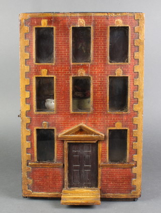 A 19th Century Naive dolls house in the form of a 3 storey building, the interior fitted 2 rooms complete with various furnishings 15 1/4"h x 10"w x 6.25"d 