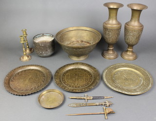 A Chinese brass bowl with engraved decoration 10", a pair of Benares club shaped vases 12", a pair of brass candlesticks 6" and a small collection of other brass items 