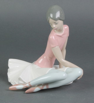 A Lladro figure of a seated ballerina 1357 7" 