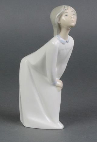 A Lladro figure of a child in a night dress 7 1/2" 