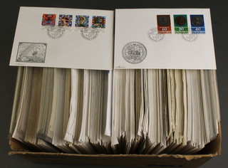 A collection of Scandinavian first day covers, a box of world stamps including coin covers etc 