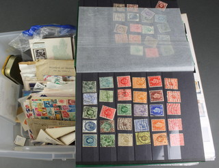 A stock book containing 22 penny reds and other used GB and World stamps, an orange stock book of mint and used stamps, first day covers etc 