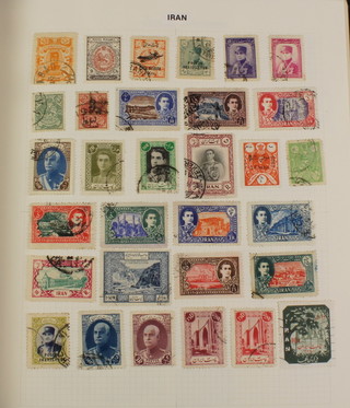 An album of mint and used stamps including Iranian, Iraq, Irish, Trieste, Italy, Ivory Coast, Japan, Jordan and Jordan Occupation of Palestine, etc