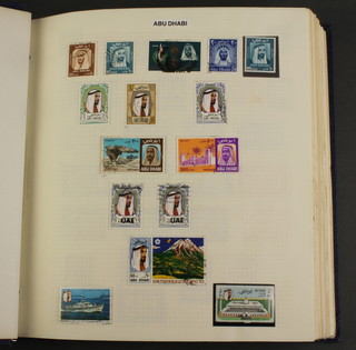 An album of stamps including Abu Dhabi, Afghanistan, Ajman, Aland Islands, Albania, Algeria, Andorra, Angola, 
