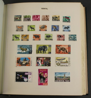 An album of mint and used stamps including Kenya, Kiribati, Malawi, Malaya, Malaysia, Maldives Islands