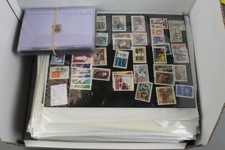 A box containing various World stamps 