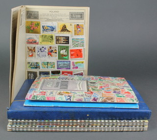 A blue stockbook of mint and used GB stamps including penny reds, 2 stock books of Commonwealth stamps and 3 school boy albums of stamps 