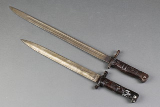A Wilkinson 1903 double edged bayonet together with a Remington 1913 bayonet, no scabbards 