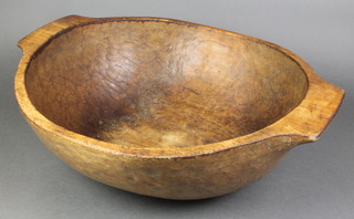 A wooden twin handled bowl 24" 