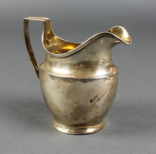 A George III silver helmet shaped cream jug with plain handle, London 1798, 130 grams 