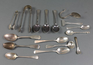 A pair of Georgian silver sugar nips, minor spoons etc, 266 grams 