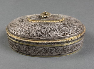 A Persian silver filigree oval trinket box with rosette handle, 236 grams  5" 