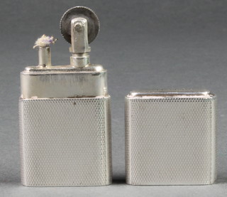 An engine turned silver cased cigarette lighter, Sheffield 1947 2 1/4"