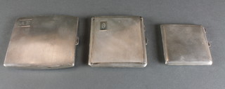 2 silver engine turned cigarette cases, a ditto compact, 264 grams gross 