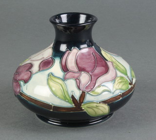 A late 20th Century Moorcroft squat baluster vase, the blue ground decorated with flowers 4" 