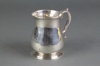 A George III silver baluster mug with S scroll handle and armorial, London 1740 3 1/2", 130 grams