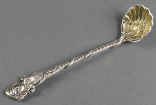 A William IV cast silver mustard spoon with shell bowl and mask terminal, London 1833, 28 grams
