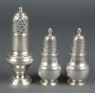 A pair of Georgian design silver baluster shakers, London 1922, a taller ditto Chester 1898, 214 grams