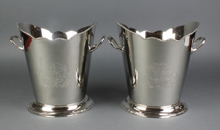 A pair of plated 2 handled wine coolers with chased decoration 