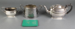 A silver plated teapot and sugar bowl, 1 other and a cased coin set 