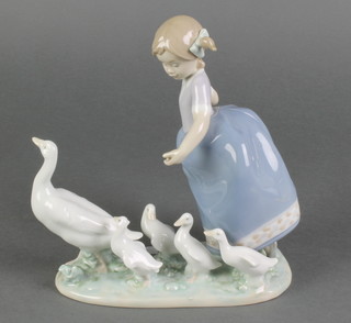 A Lladro group of a young girl with a family of geese 5503 7" 