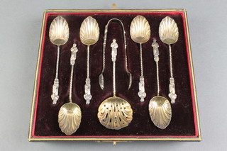A set of 6 Victorian silver apostle teaspoons with shell bowls, a pair of nips and a sifter spoon  - cased, Sheffield 1897, 70 grams 