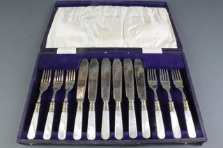 A cased set of 6 silver plated fish eaters with mother of pearl handles