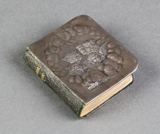 An Edwardian repousse silver covered book of Common Prayer with Reynolds angel decoration, Birmingham 1904 2" 