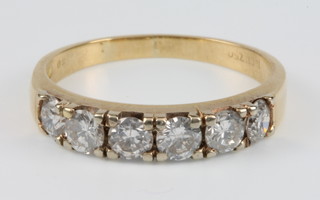 An 18ct yellow gold 6 stone diamond ring, approx 1.2ct, size P 