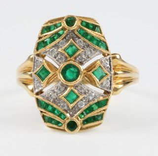 An 18ct yellow gold emerald and diamond up finger Art Deco style ring, size R 1/2