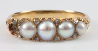 A Victorian yellow metal 4 ex 5 pearl and diamond ring, size M