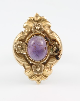A 9ct gold repousse up finger dress ring set with a cabuchon cut amethyst size M 1/2