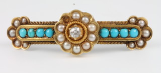 A Victorian yellow gold brooch, the centre set with a single stone diamond approx. 0.25ct surrounded by 9 ex10 seed pearls flanked by 4 turquoise and 5 seed pearls 